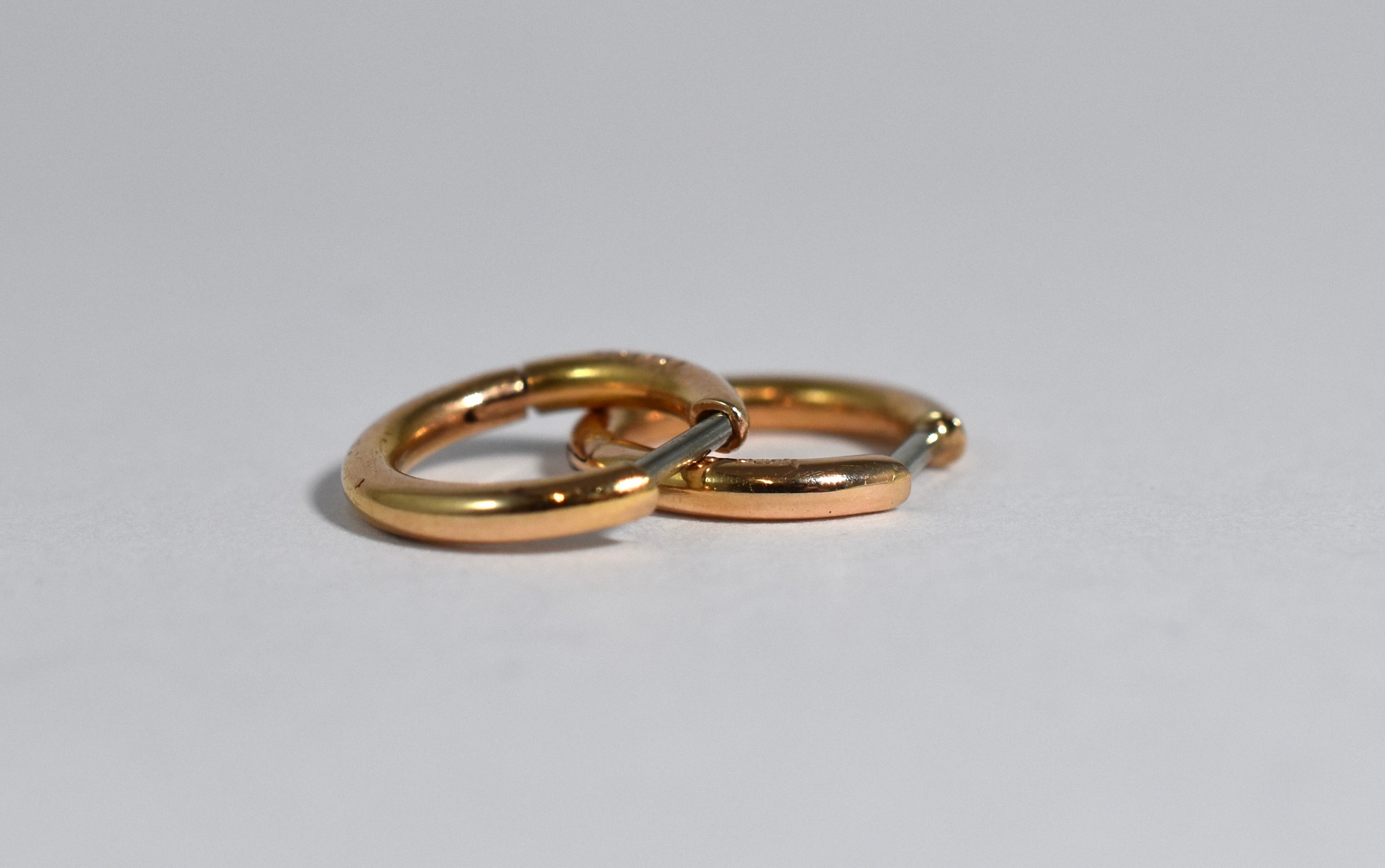 18 karat red gold small locking hoops