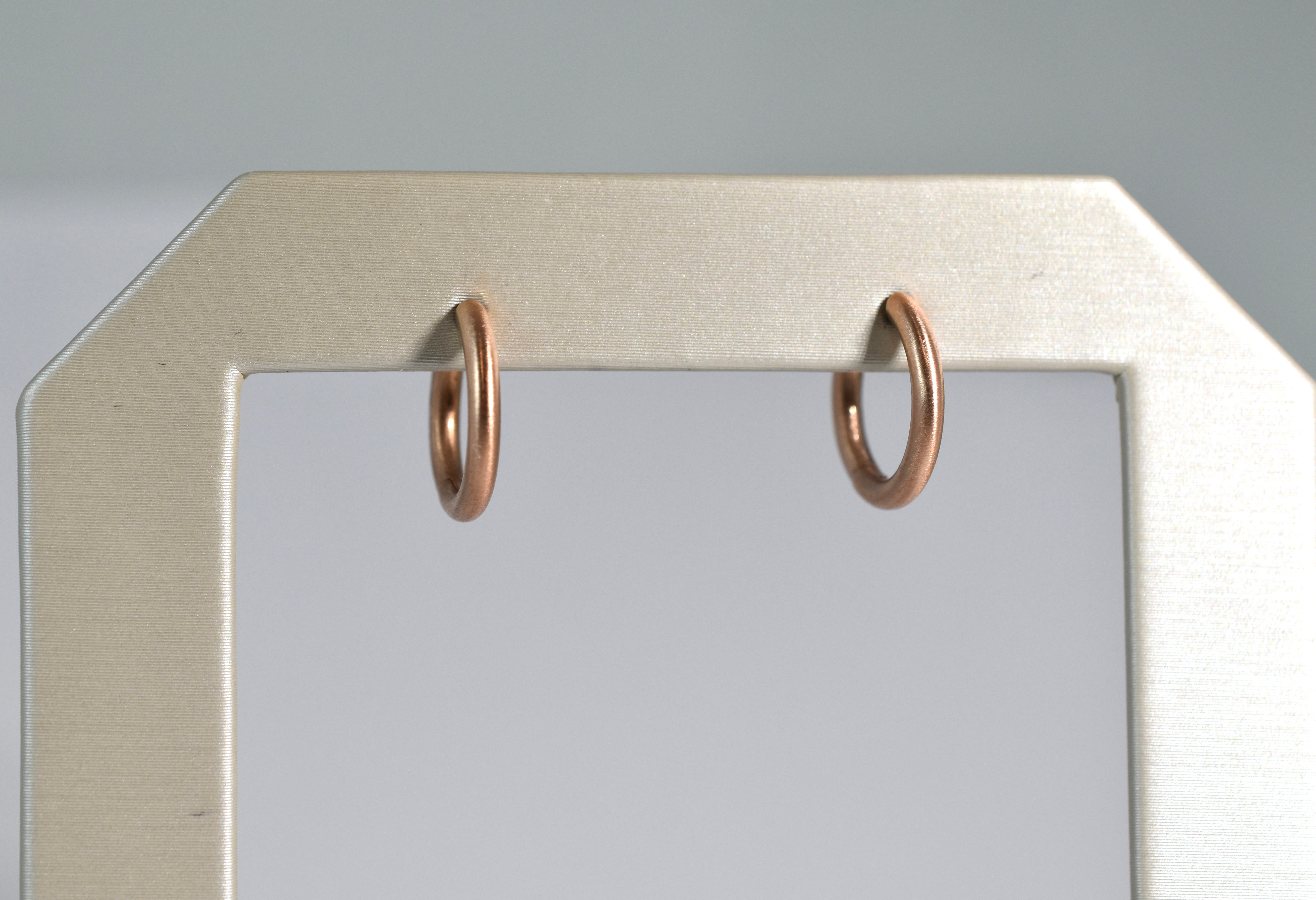 18 karat red brushed gold medium locking hoops