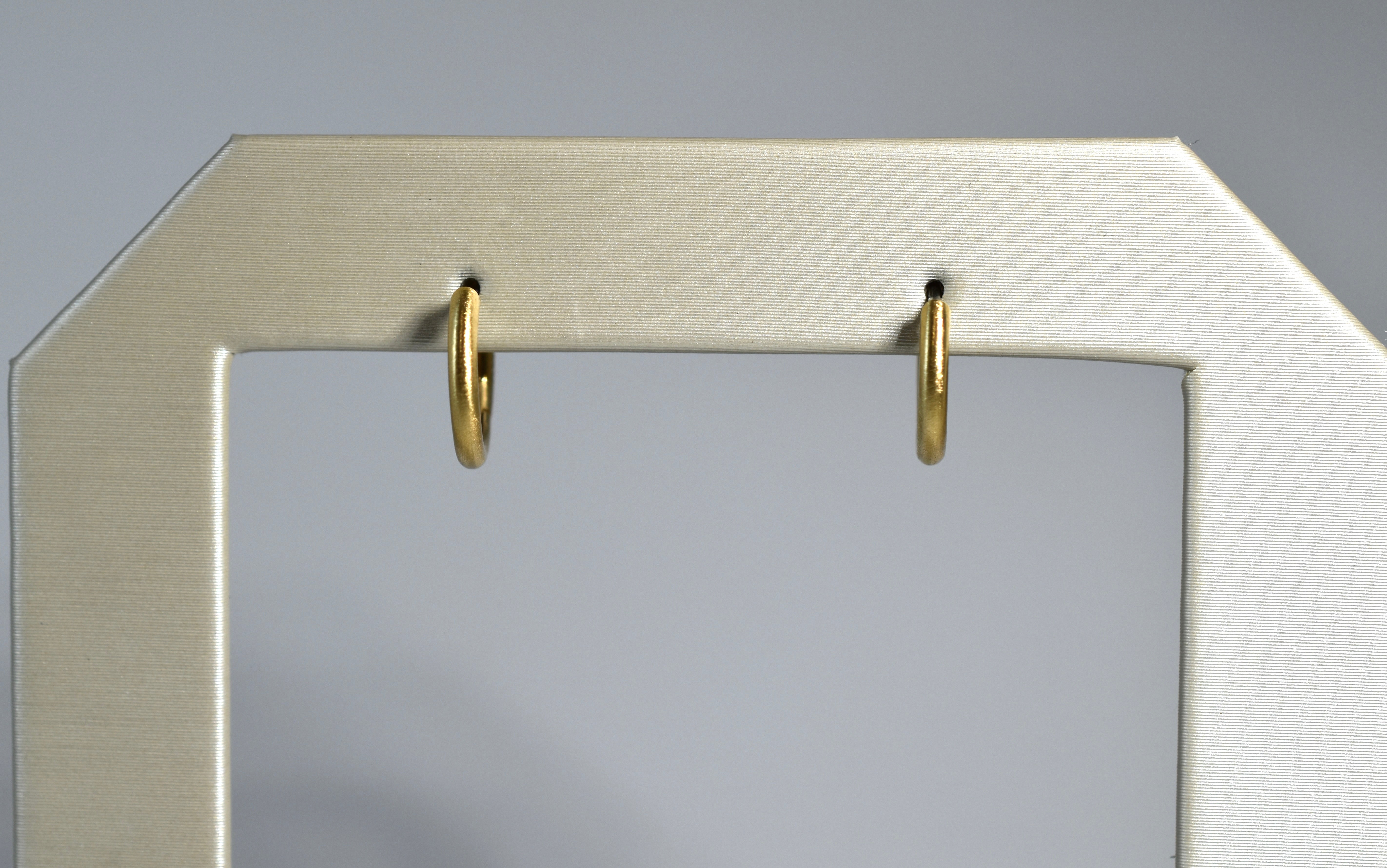 18 karat brushed yellow gold small locking hoops