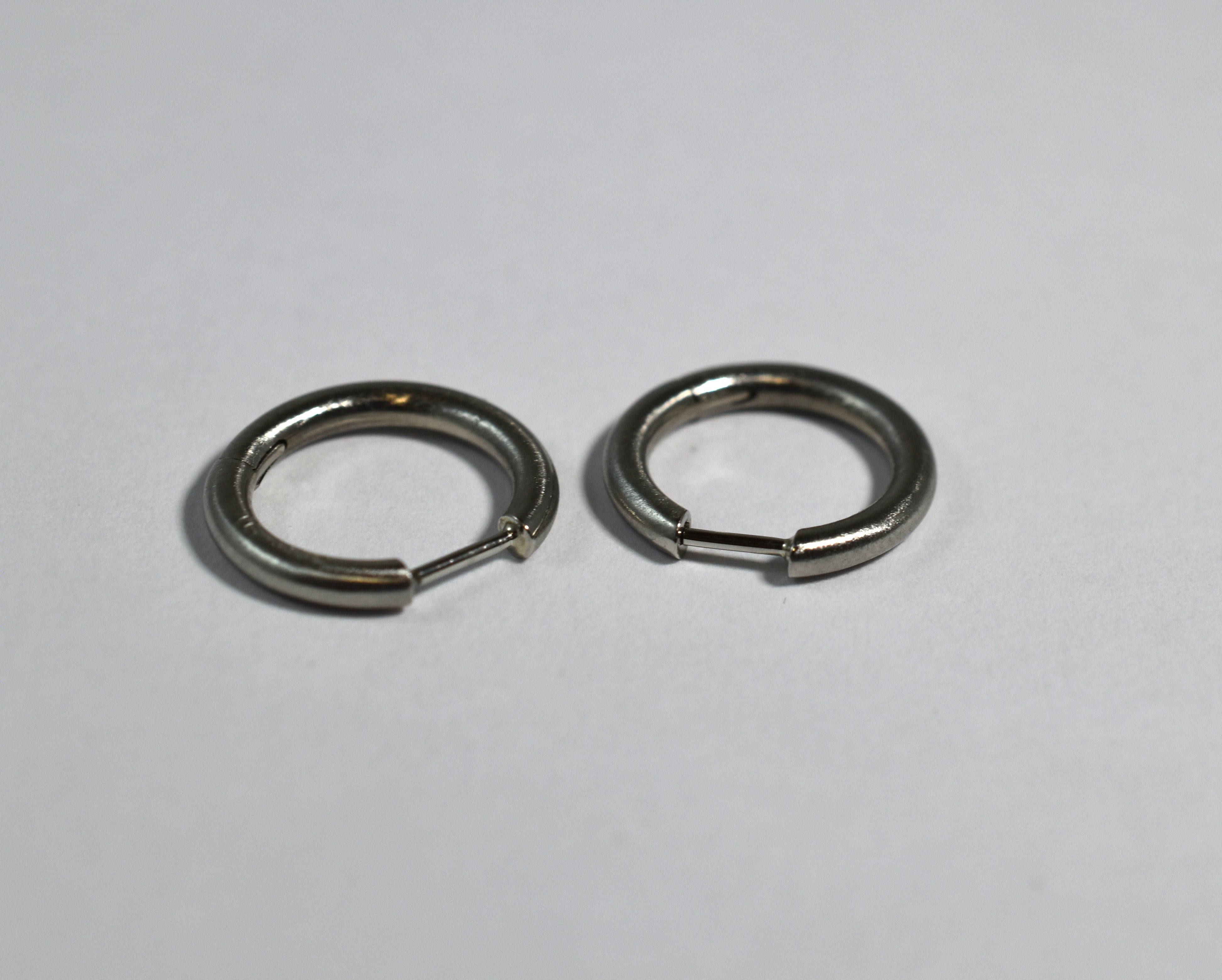 19 karat white brushed gold medium locking hoops
