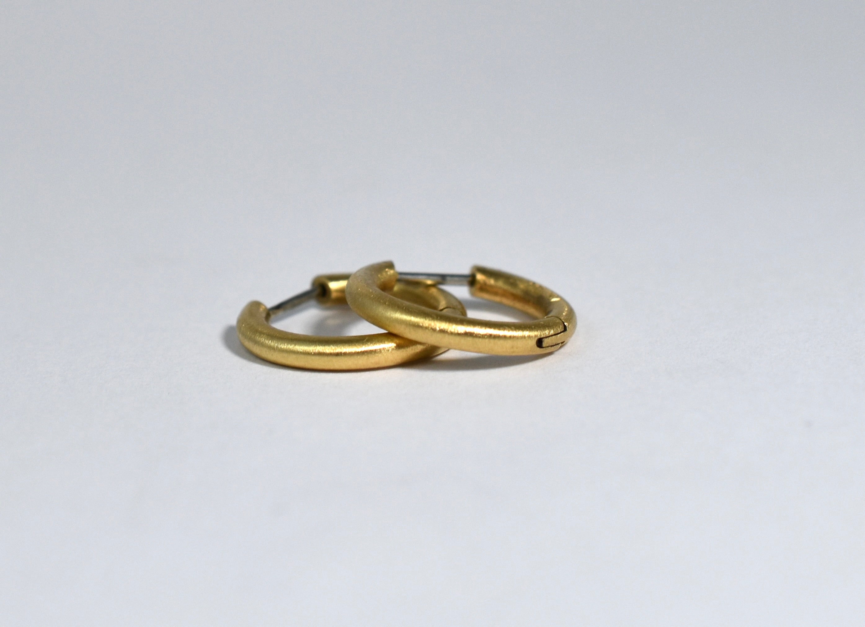 18 karat brushed yellow gold small locking hoops