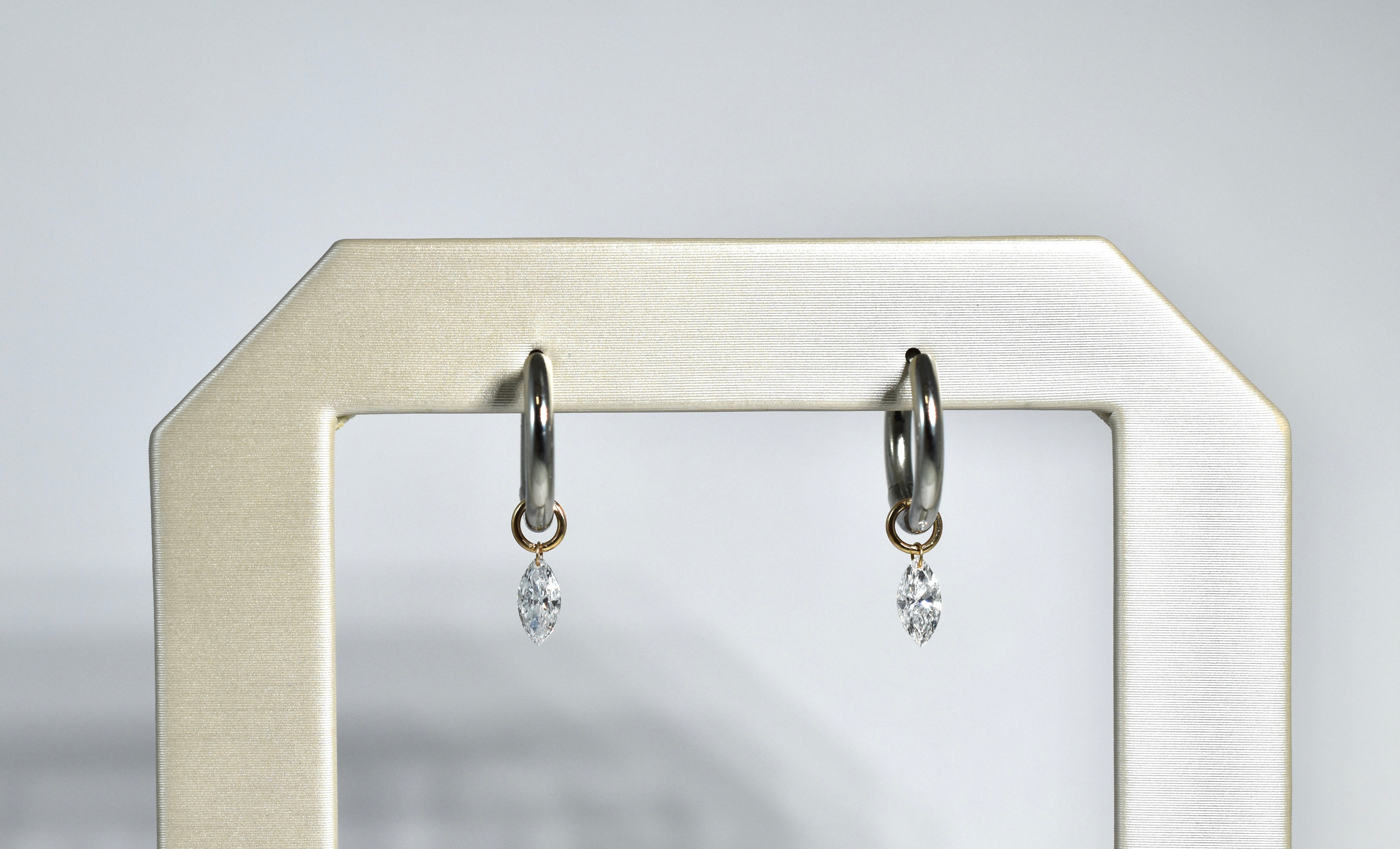 14 karat yellow gold drilled marquise diamond drops