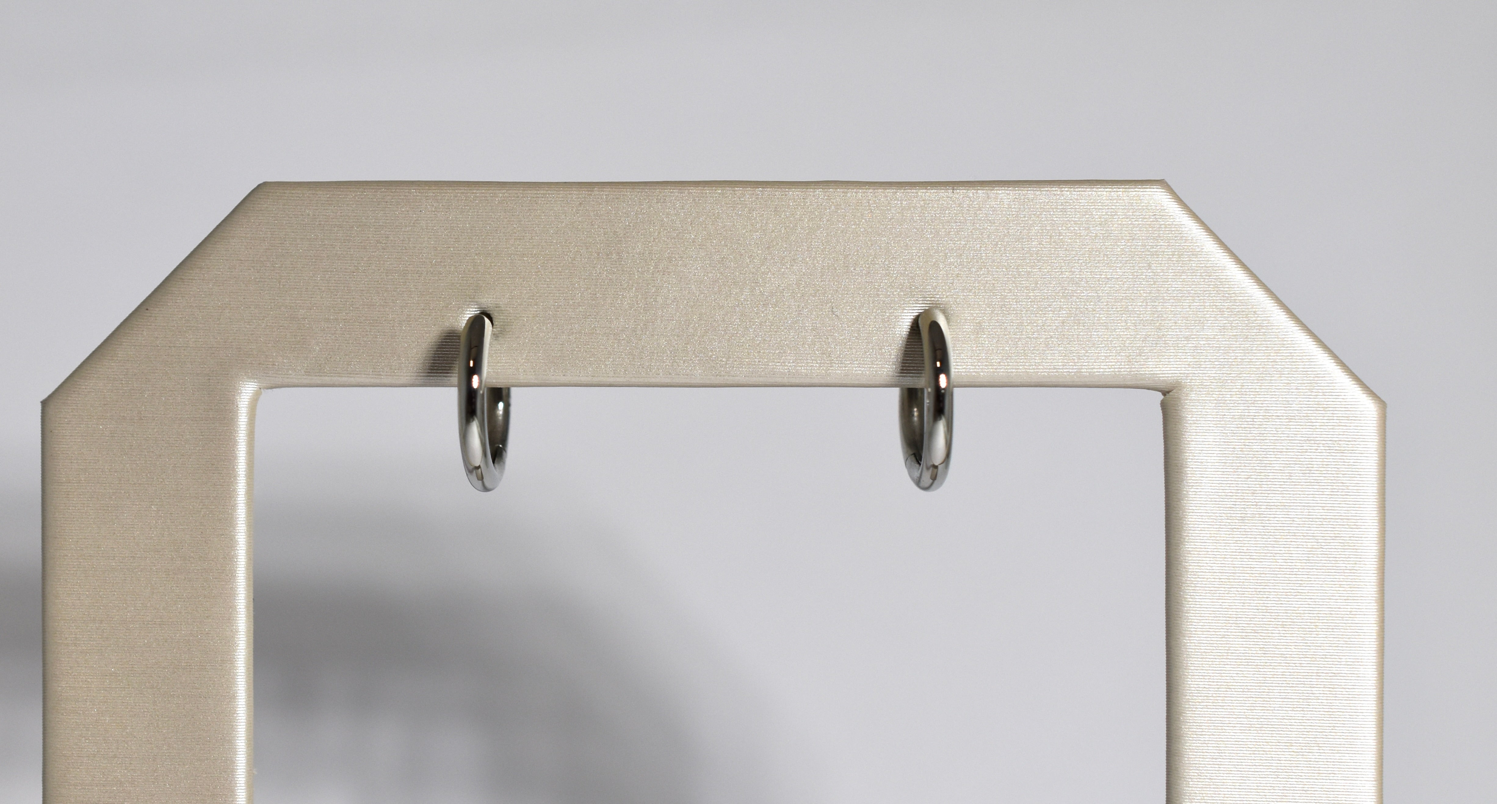 19 karat white gold small locking hoops
