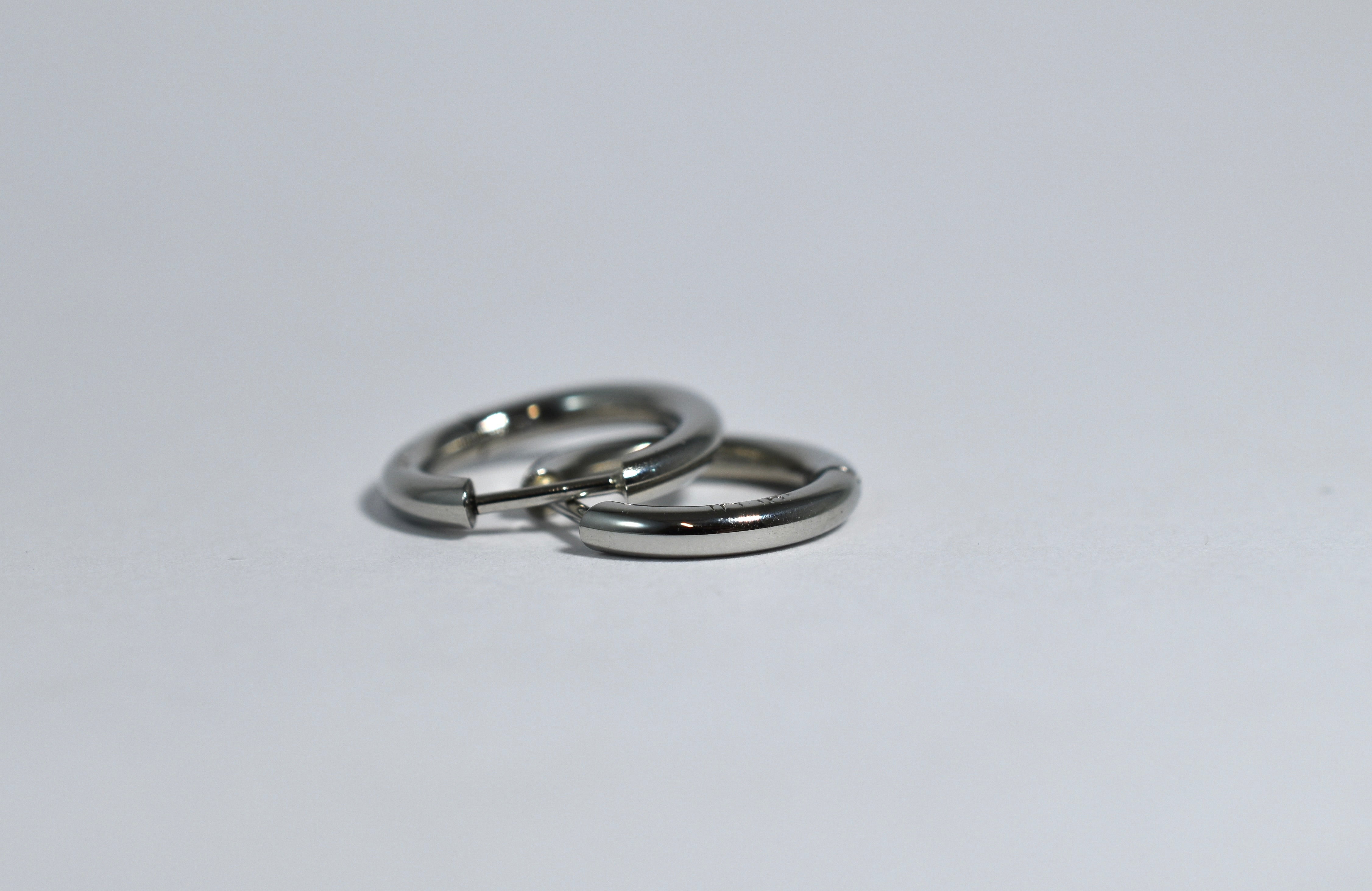 19 karat white gold medium locking hoops