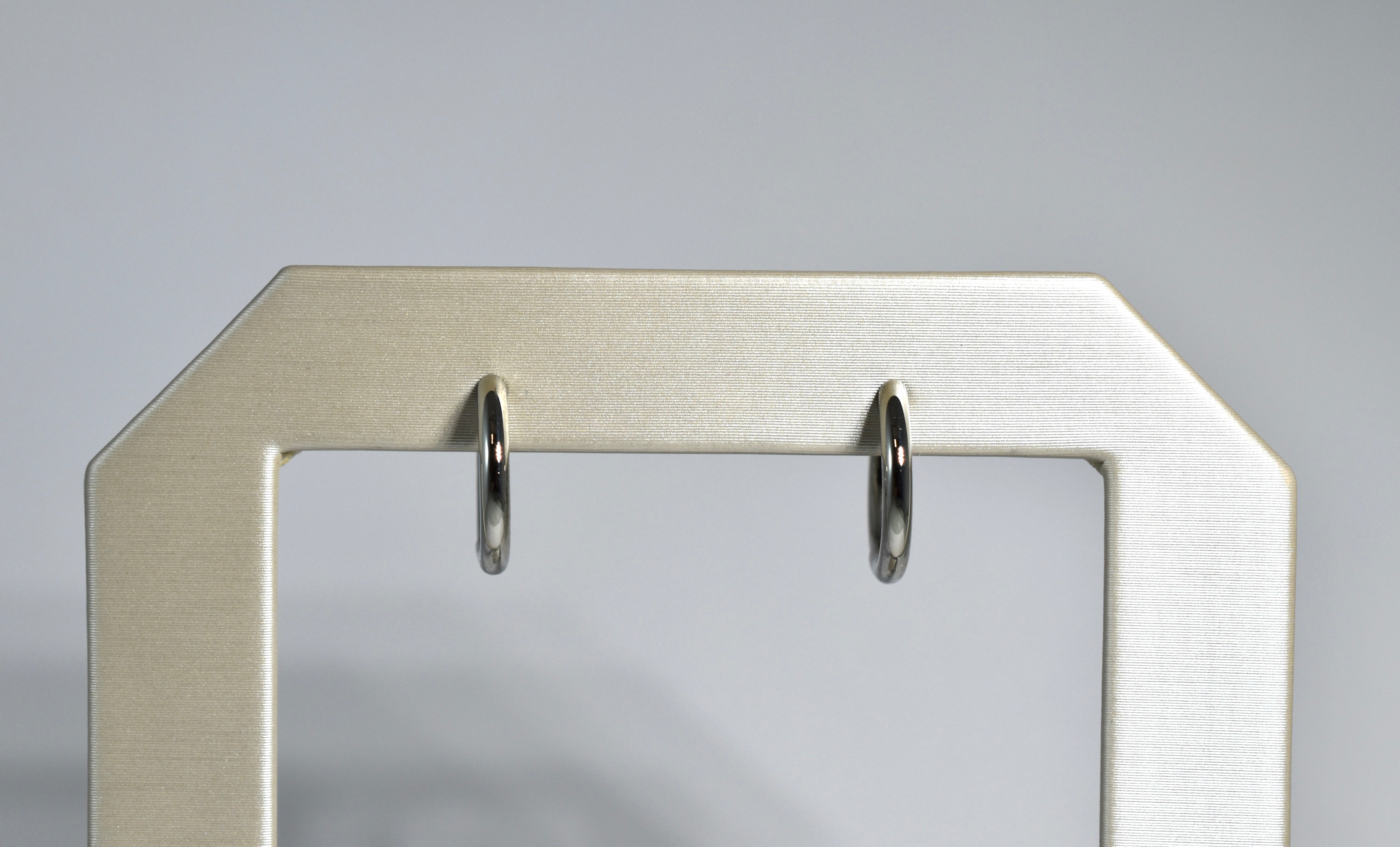 19 karat white gold medium locking hoops