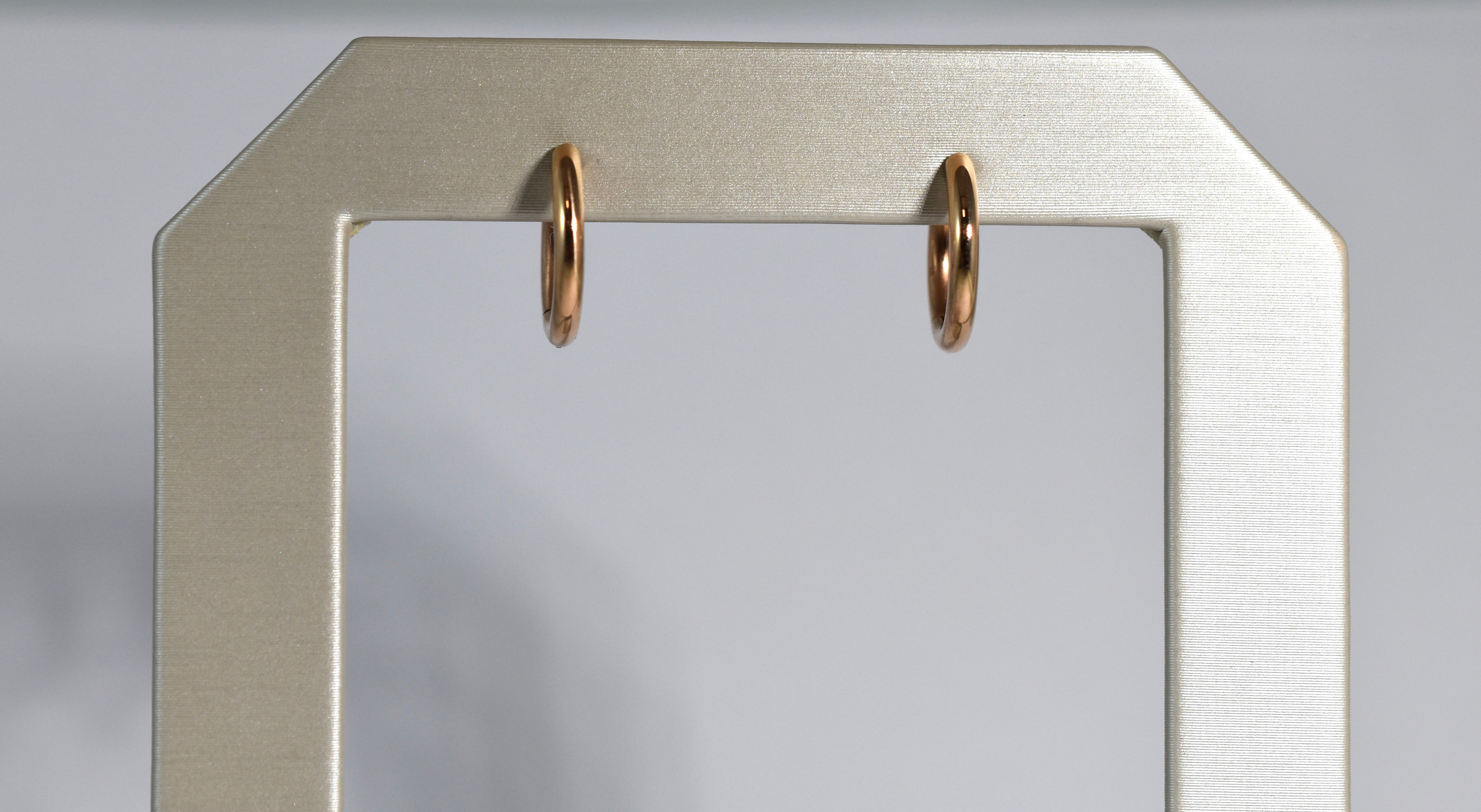 18 karat red gold small locking hoops