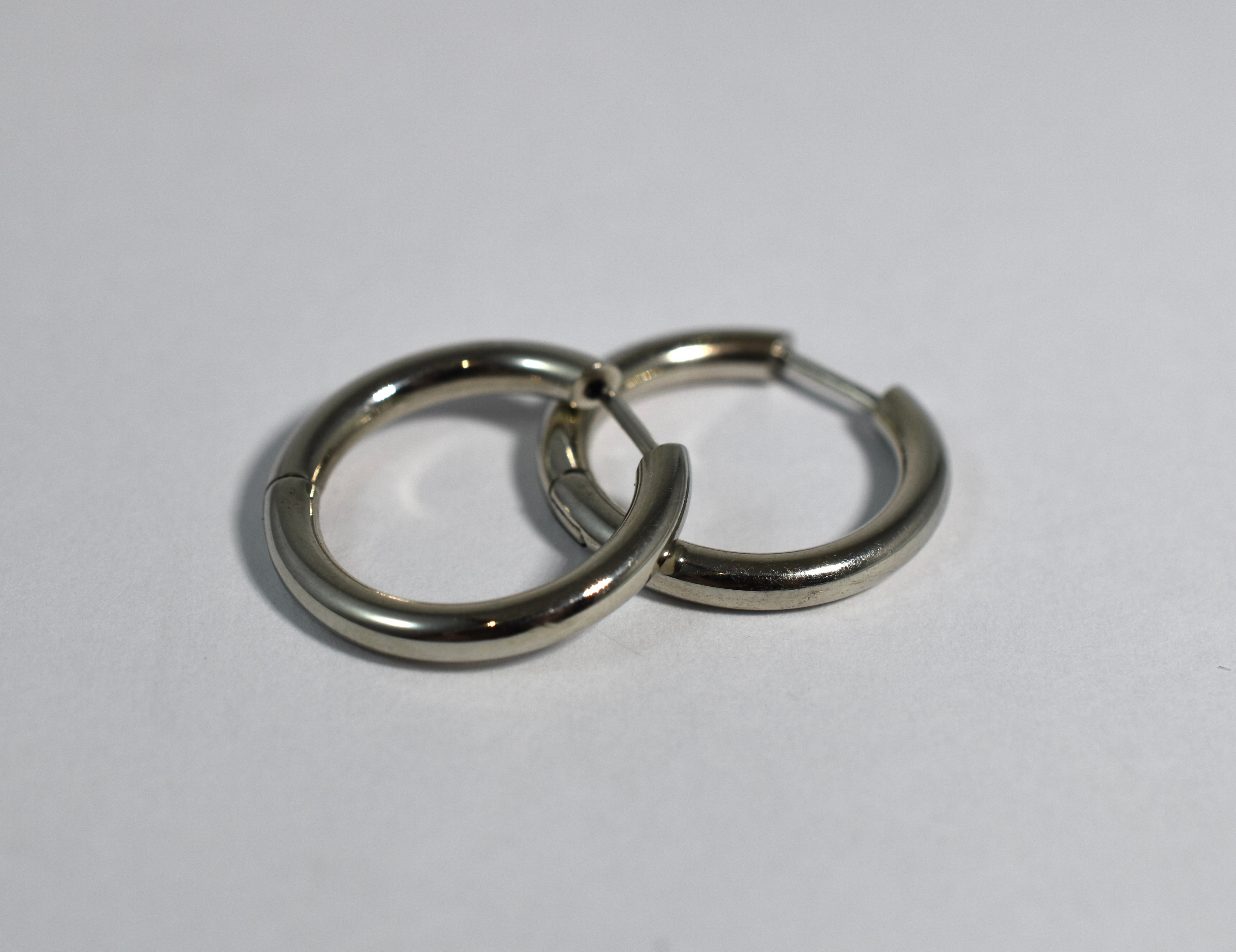 19 karat white gold large locking hoops