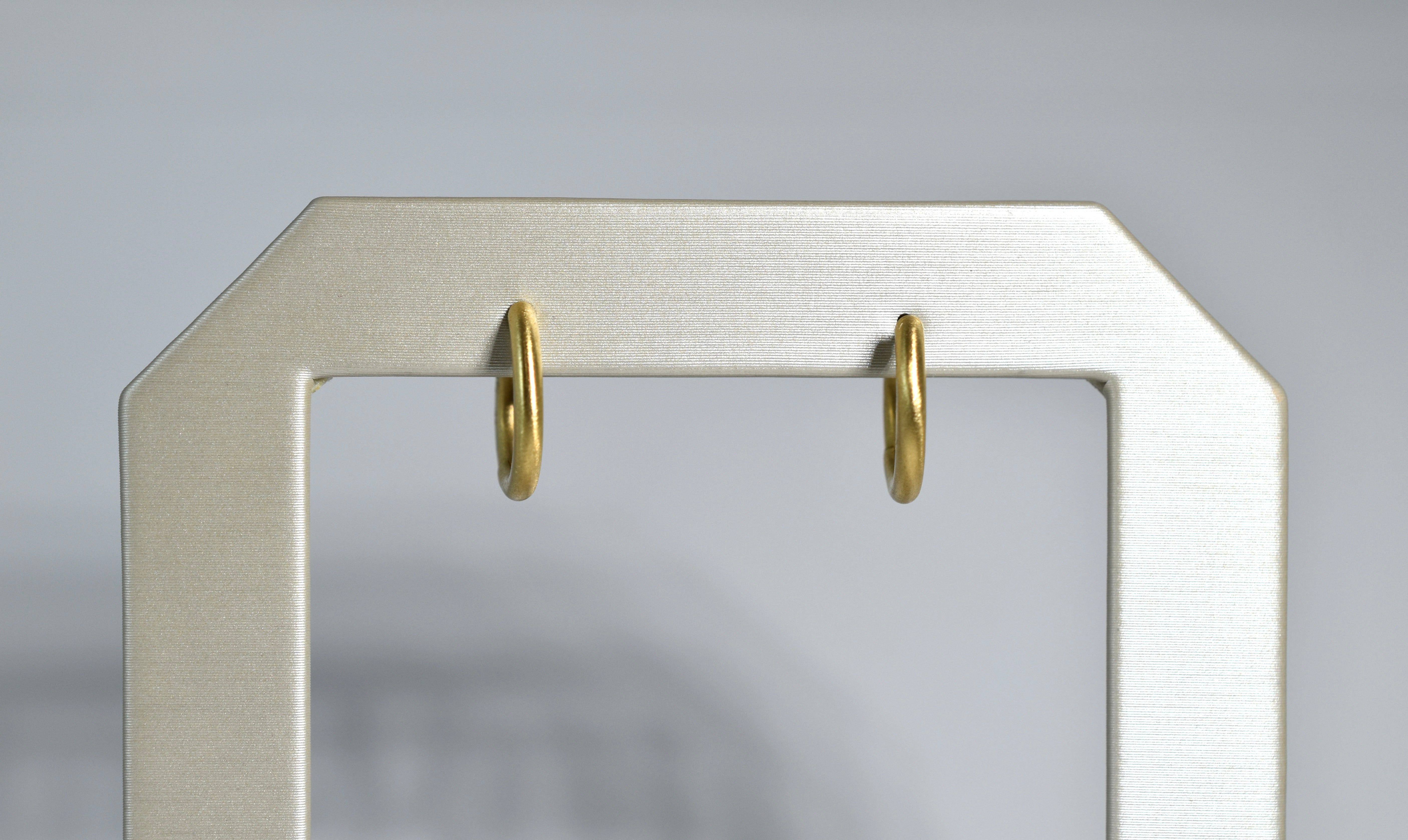 18 karat yellow brushed gold medium locking hoops