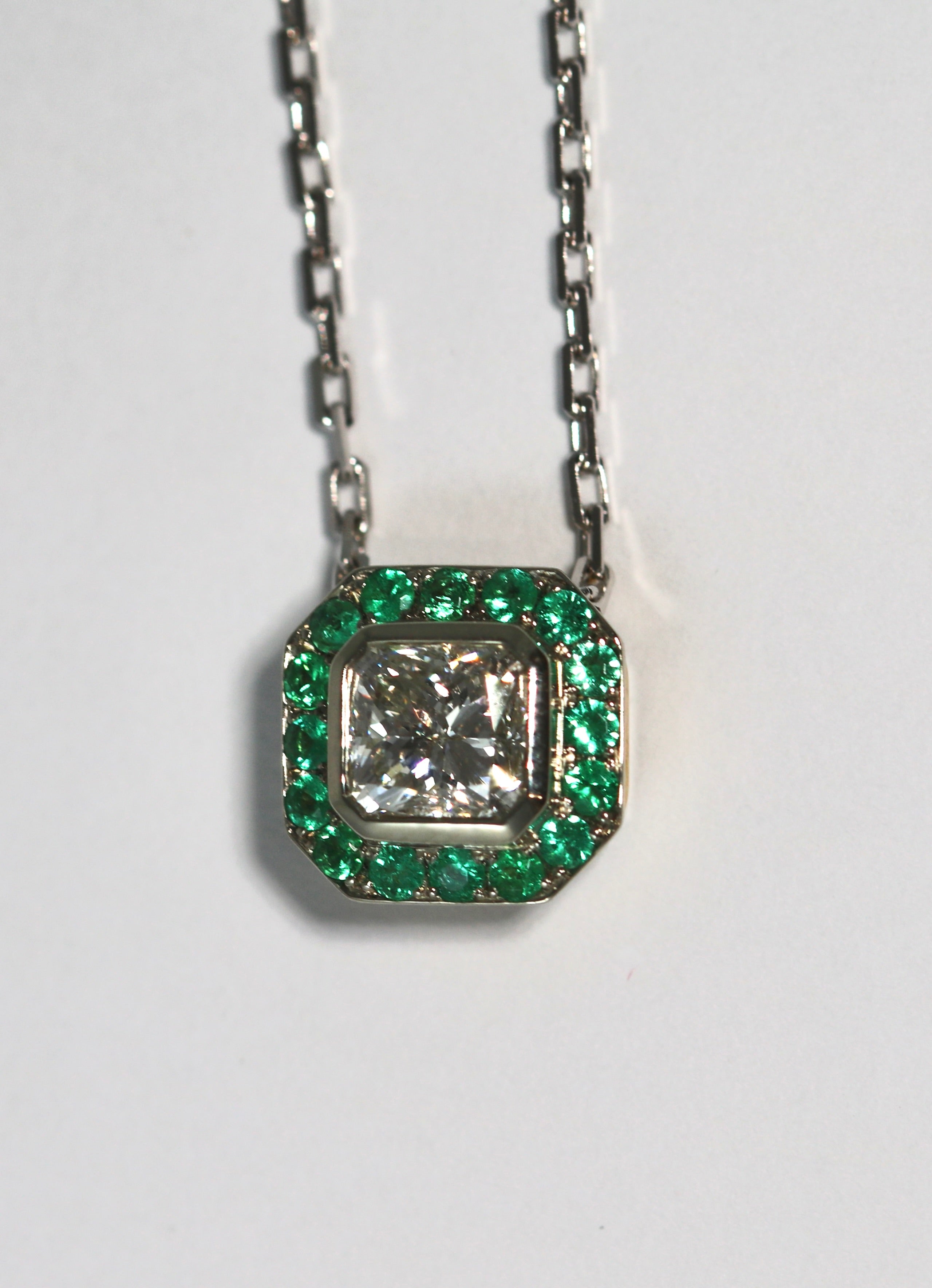 Cut Corner Square Diamond Pendant with Emerald Halo
