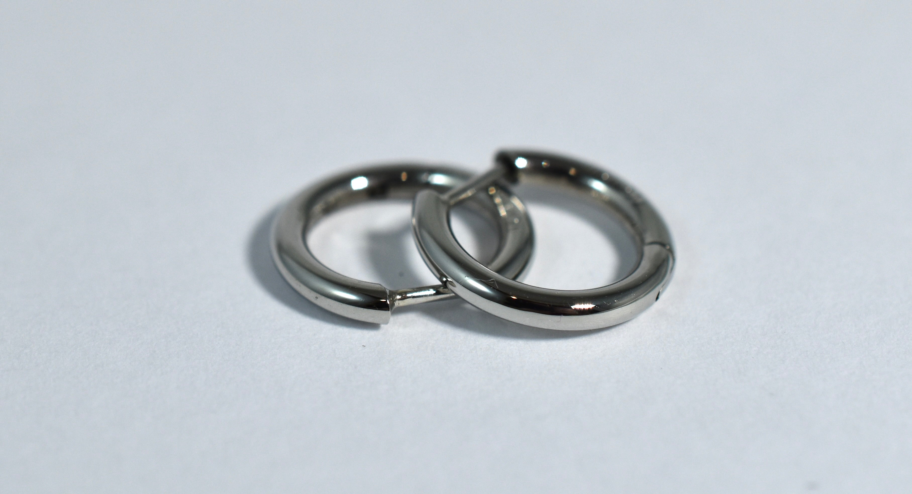 19 karat white gold small locking hoops